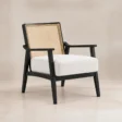 Cane Sculpt Armchair with white upholstered seat and natural cane back, angled front view