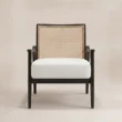 Front view of Cane Sculpt Armchair with white seat and natural cane back
