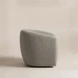 Side view of the CreamCove curved armchair in grey upholstery