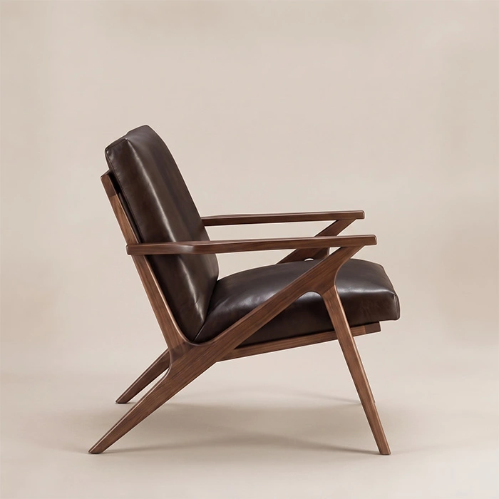 fiora-mid-century-armchair-dark-brown-side-view. Side view of Fiora Mid-Century Armchair showing open wooden arms and angled legs