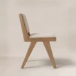 Side view showing the Noble dining chair’s slim frame and gently angled back
