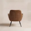 Back view of Varden Lounge Armchair showing its curved upholstered shell and slim metal base