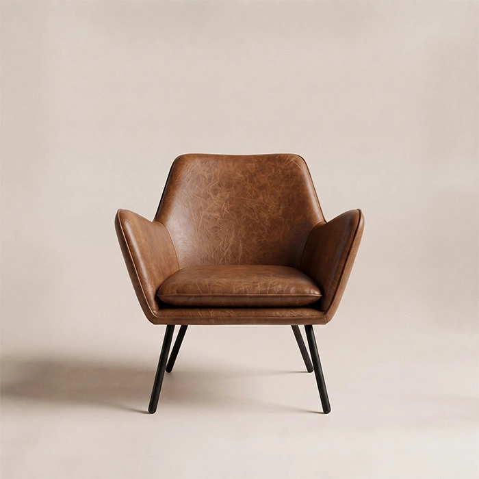 Front view of Varden Lounge Armchair in cognac brown upholstery with black metal legs