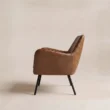 Side view of Varden Lounge Armchair showing its reclined back, raised arms and black metal legs