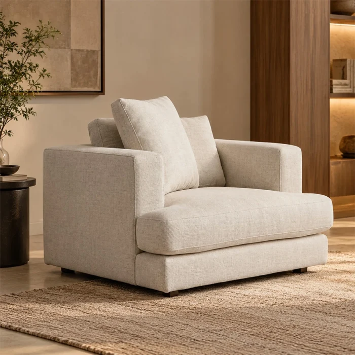 Velora Soft Armchair in white upholstery styled in a warm contemporary living room