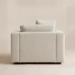 Rear view of Velora Soft Armchair with fully upholstered back and low wooden feet