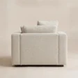 Rear view of Velora Soft Armchair with fully upholstered back and low wooden feet
