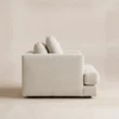 Side view of Velora Soft Armchair showing deep seat, low profile and white upholstery
