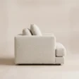 Side view of Velora Soft Armchair showing deep seat, low profile and white upholstery