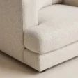Close-up of Velora Soft Armchair white textured upholstery, seat cushion and upholstered arm