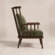 Side angle showing the Windsor Nest armchair’s tall spindle back and wooden arms