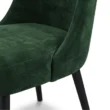 close view of chair showing green velvet upholstery