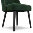close view showing black metal legs of chair