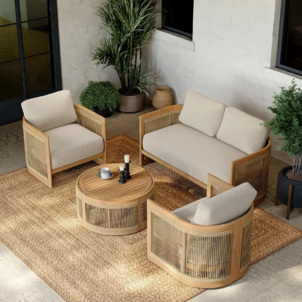 Meridian Outdoor Sofa Set Meridian outdoor patio lounge set with sofas, chair, and round coffee table in outdoor setting