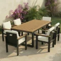 Teak outdoor dining set on patio with white cushioned chairs, outdoor dining set with umbrella hole
