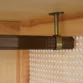 “Rattanix wardrobe clothes rail detail with metal hanging rod inside rattan cabinet