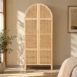 Rattanix Wardrobe styled in a warm bedroom with arched cane doors and raised legs