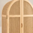 Close-up of woven cane doors and recessed wooden handles on the Rattanix Wardrobe