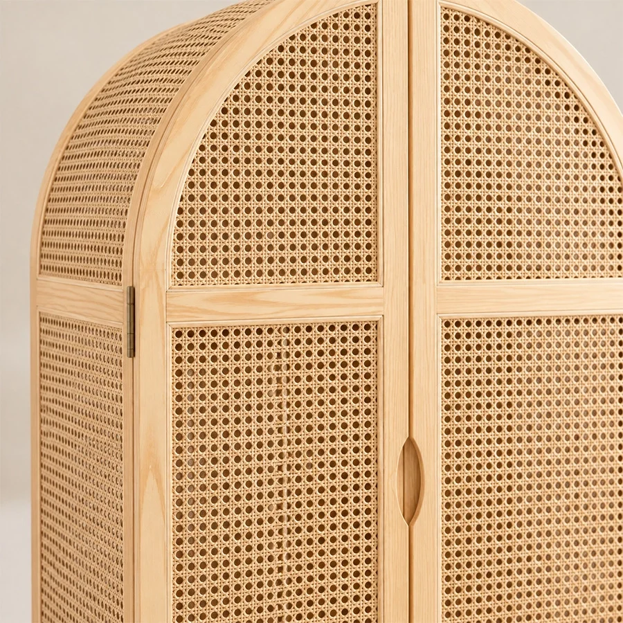 rattanix-wardrobe-closeup-view. Close-up of woven cane doors and recessed wooden handles on the Rattanix Wardrobe