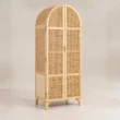 Angled view of Rattanix Wardrobe with arched cane frontage and natural wood frame