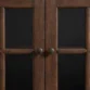 close view of knob and glass door of cabinet