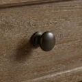 close view showing metal knob and grainy texture