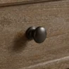 close view showing metal knob and grainy texture