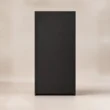 Rear view of the tall matte-black Tressel wardrobe