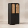 Angled view of black 2-door cane wardrobe with natural woven panels