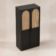 Elevated view of 2-door wardrobe with black frame and arched cane fronts