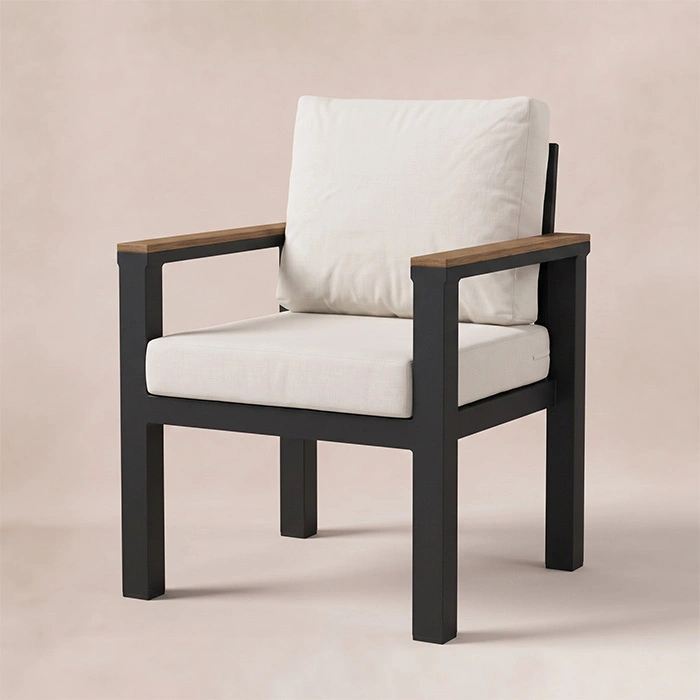 quartz-outdoor-dining-chair-angle-view. Quartz dining armchair with light cushions and wood armrests, angled view