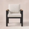Cushioned outdoor dining armchair with dark frame and wood armrests, front view