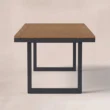 Rectangular outdoor dining table with warm wood top and dark frame
