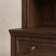 Close-up of Brown Wash finish, moulded detailing and metal drawer knob on Stalwart Bookshelf Cabinet
