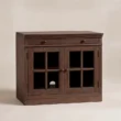 Stalwart Glass Door Cabinet in Brown Wash with top drawer and framed glass doors.