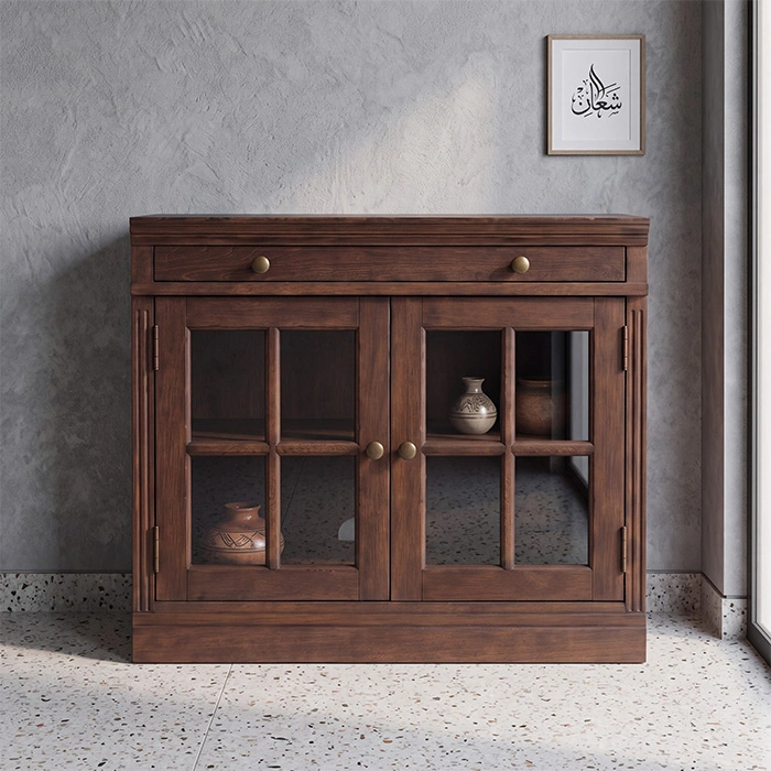 Brown Wash glass door cabinet styled with pottery in a contemporary interior.