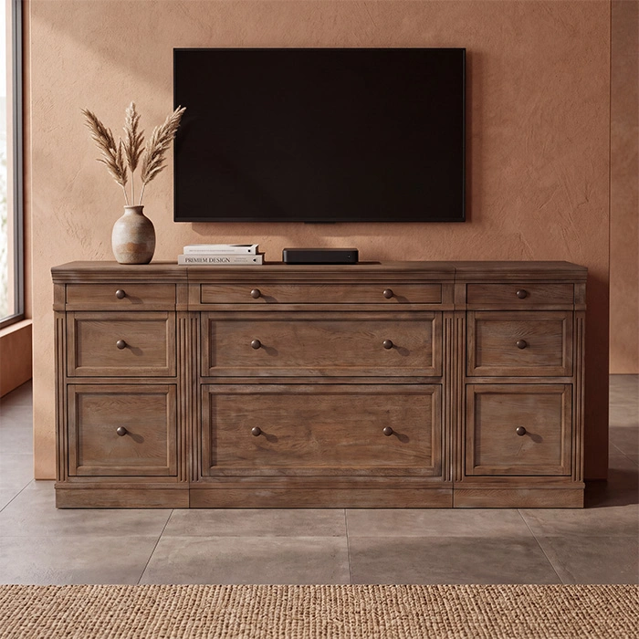 Stalwart Media Console in Brown Wash displayed beneath a wall-mounted TV in a living room
