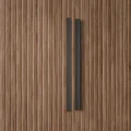 Detail shot of the heavy-duty metal handle and ribbed door paneling on the Graino slatted bedroom Almirah.