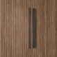 Detail shot of the heavy-duty metal handle and ribbed door paneling on the Graino slatted bedroom Almirah.