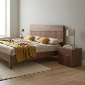 angled view of woodden bed in simple bedroom