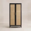 Front view of black two-door wardrobe with natural cane panels
