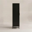 Side profile of the black wardrobe showing its slim raised frame