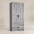 Angled view of Frost Wardrobe in grey finish with two doors and drawers
