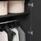 Close-up of the premium fluted wood texture and scratch-resistant foil coating on the Graino modern wardrobe doors.