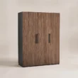 Angled view of Graino wardrobe with walnut fluted doors and black frame