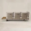 Back view of the Nookline sectional showing its slim back panels and fixed base