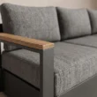 Close-up of solid teak armrest and grey outdoor upholstery