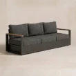 Angled view of 3-seater sofa with teak arm accents