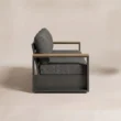 Side view showing metal frame, teak armrest and deep cushions
