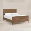 Aldren wooden bed in Pakistan, angled view with warm brown finish, panel headboard and matching footboard.